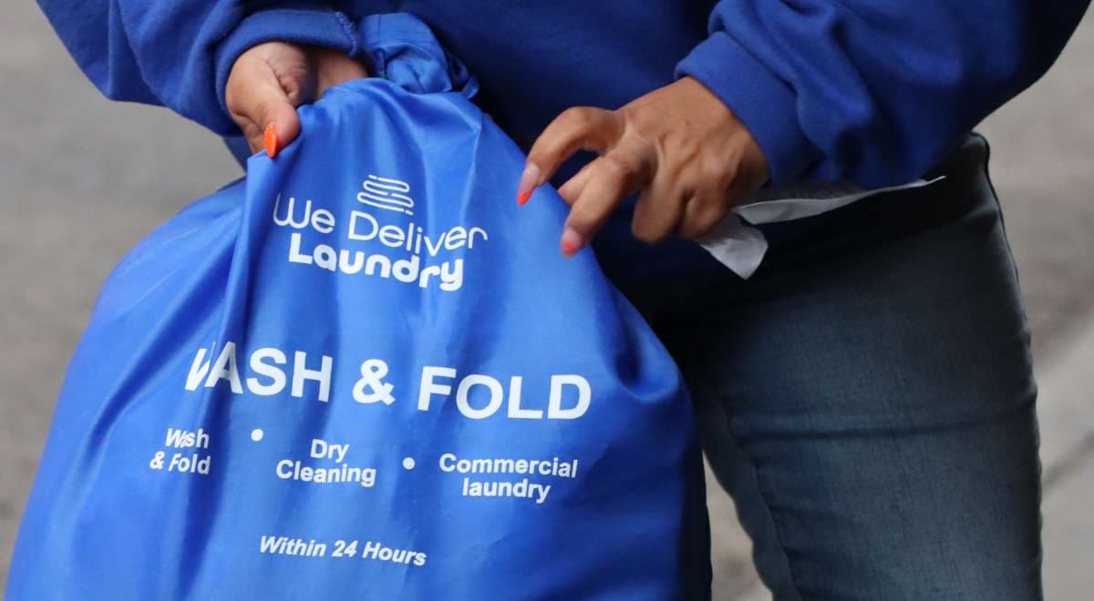 Driver collecting bulky items for specialty wash
