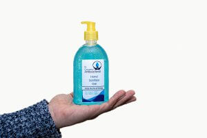 hand sanitizer bottle in hand. does hand sanitizer stain your clothes?